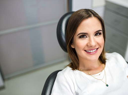 Closeup of patient smiling in treatment chair